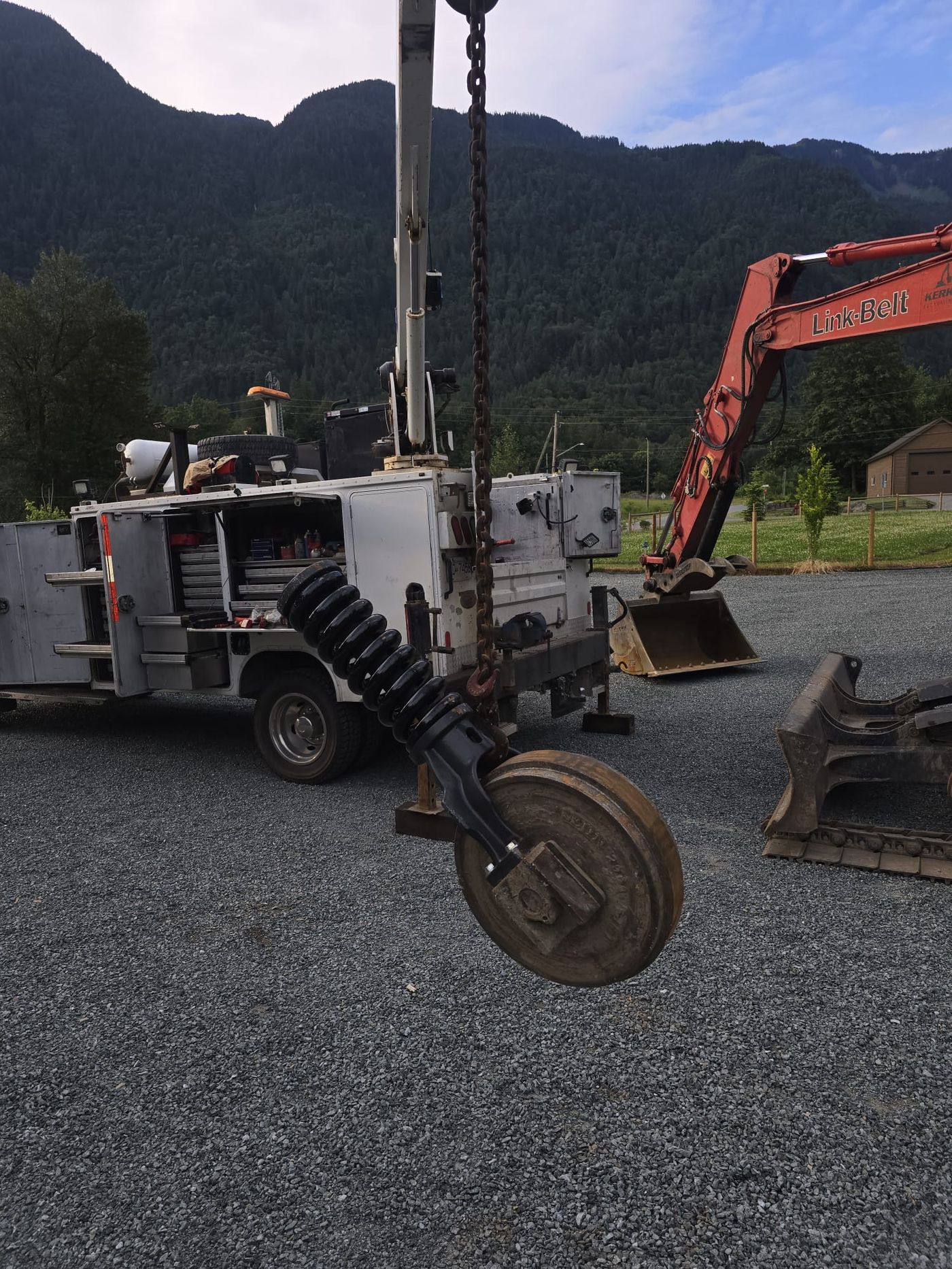 Mazdock service truck's fully stocked diagnostic toolbox drawers open, with an excavator bucket and Link-Belt excavator in the background near Agassiz BC